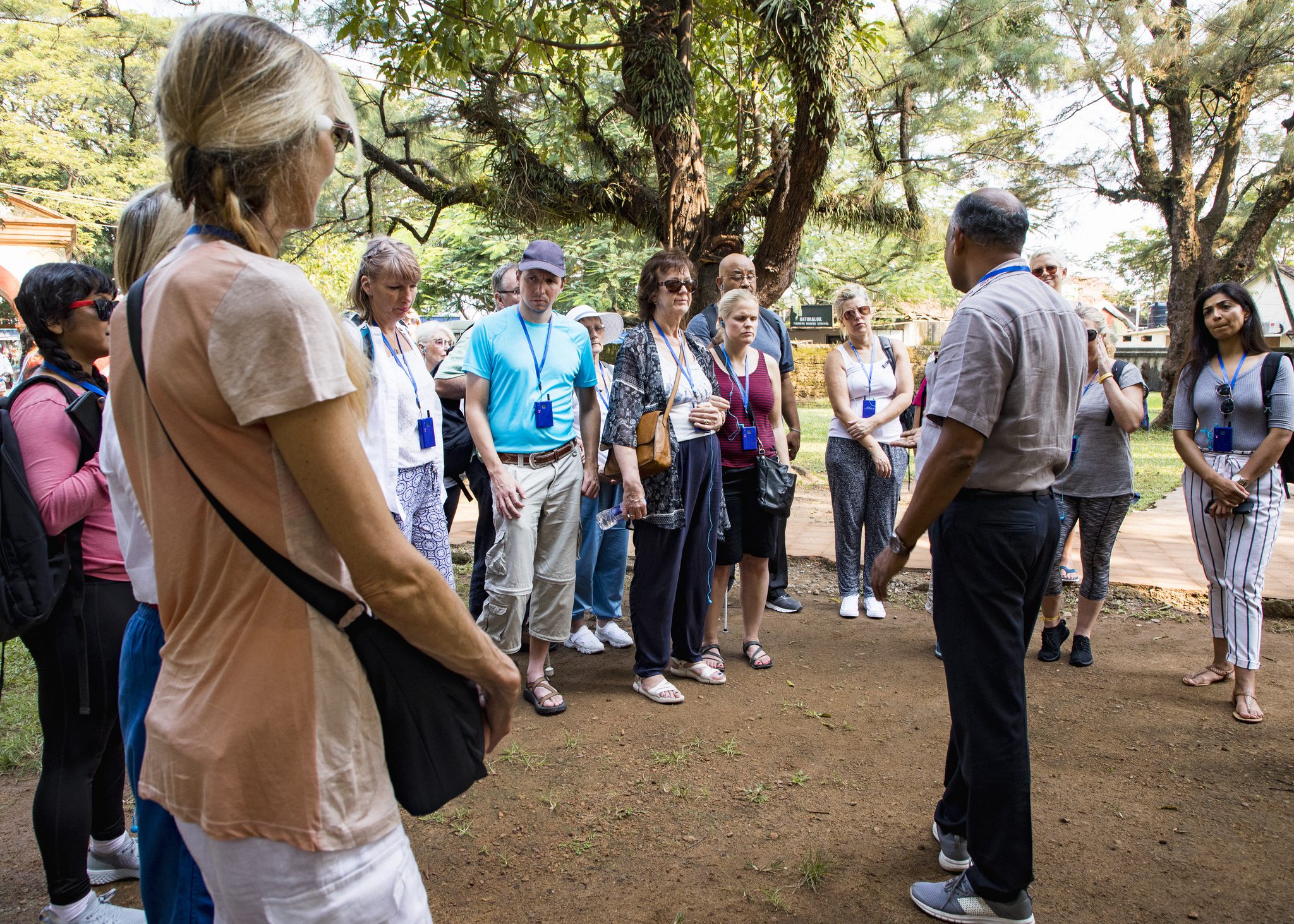 Group of people listening to a guide.