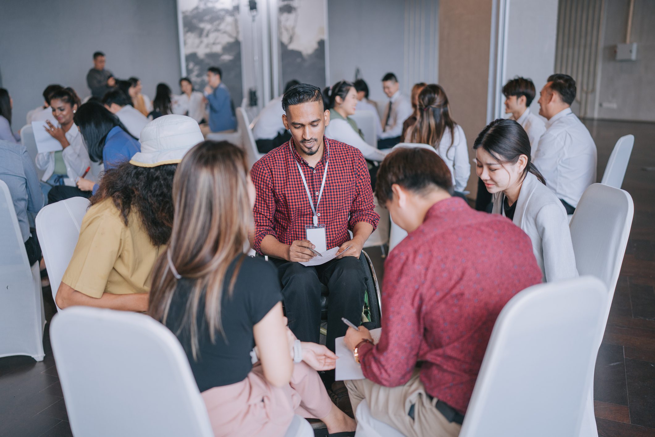 Group discussion in a conference room setting.